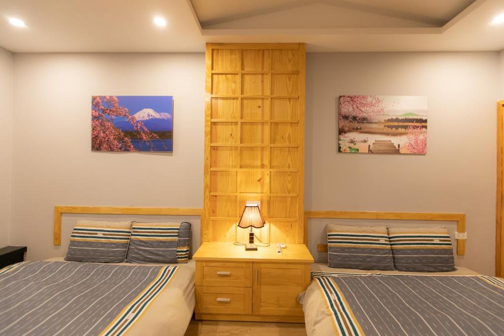 Giường trong phòng chung tại Nguyễn Tài Hostel &amp; Coffee Đà Lạt