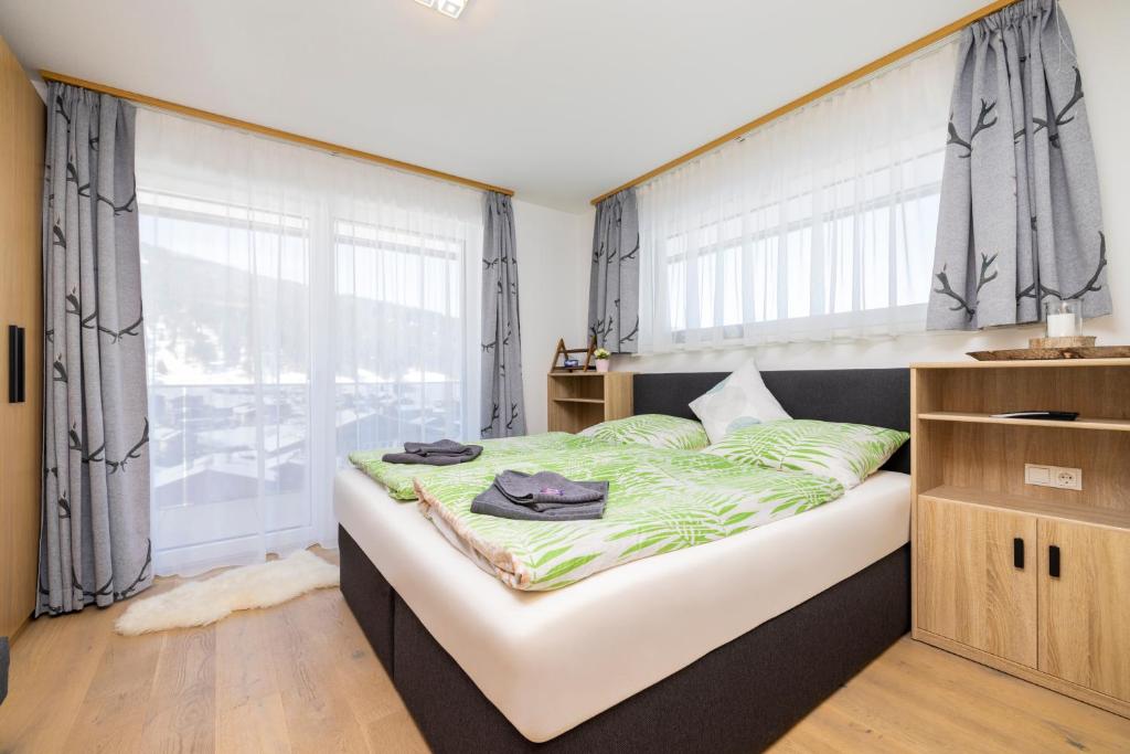 Posteľ alebo postele v izbe v ubytovaní Fischis Alpen Appartements