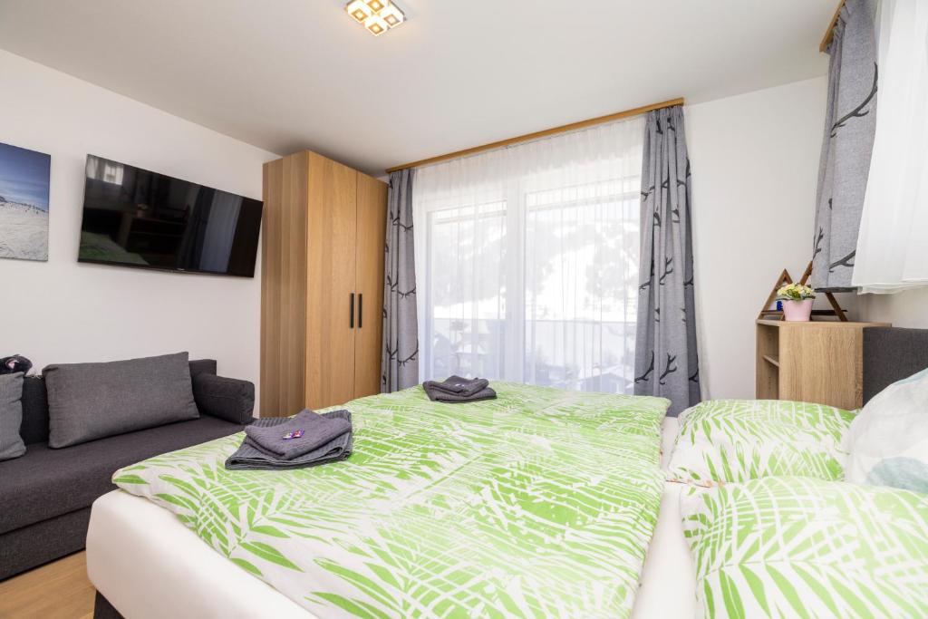 Posteľ alebo postele v izbe v ubytovaní Fischis Alpen Appartements