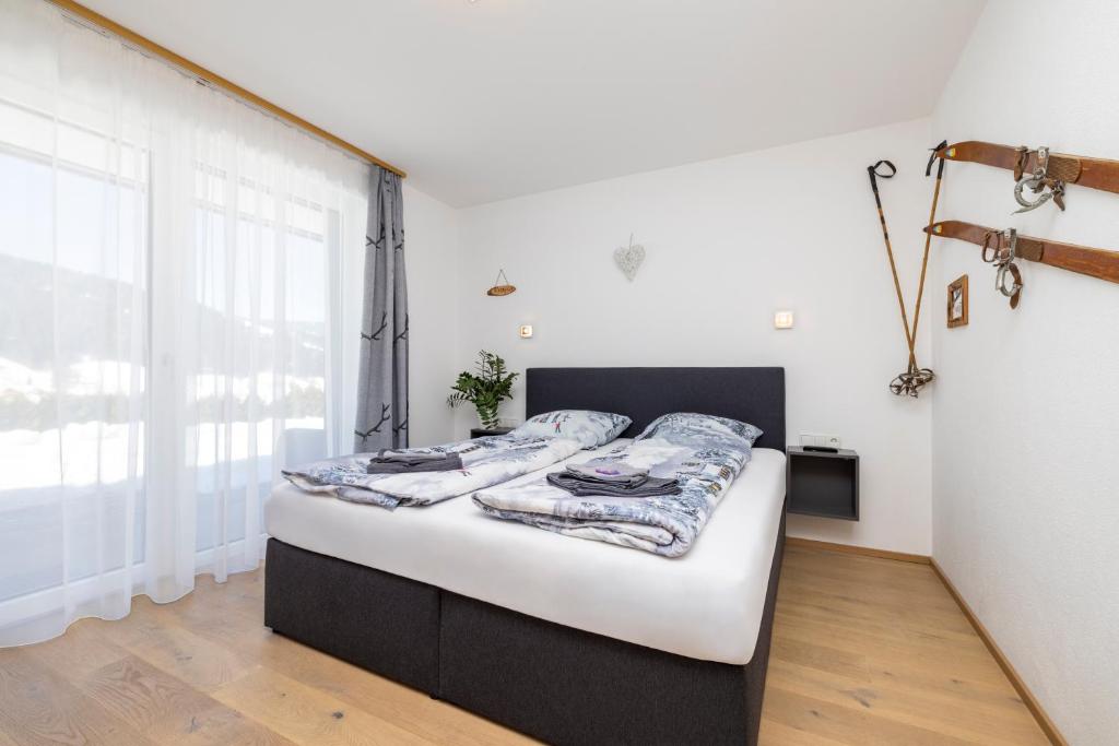Posteľ alebo postele v izbe v ubytovaní Fischis Alpen Appartements
