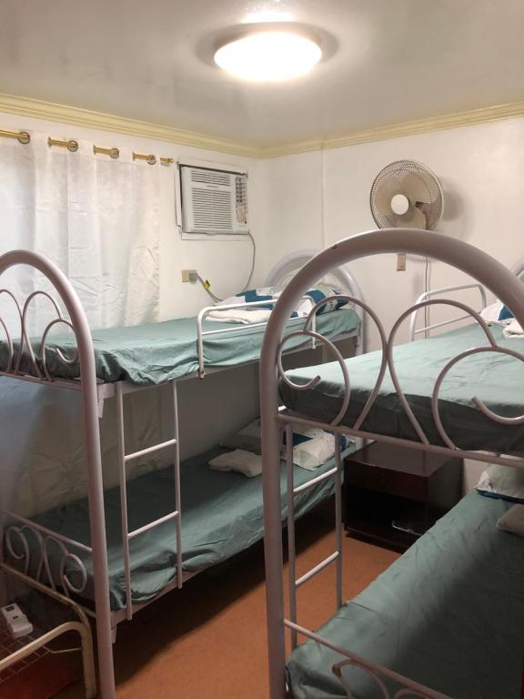 a room with two bunk beds in a hospital at THE MANSION- Near NAIA Airport Terminal PASAY in Manila