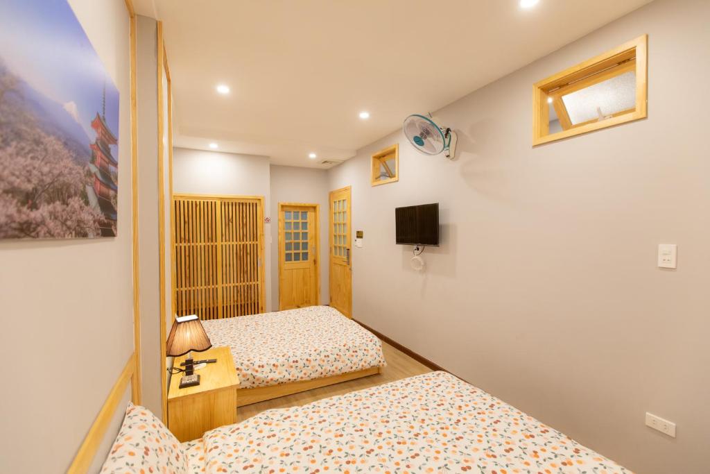 Giường trong phòng chung tại Nguyễn Tài Hostel &amp; Coffee Đà Lạt