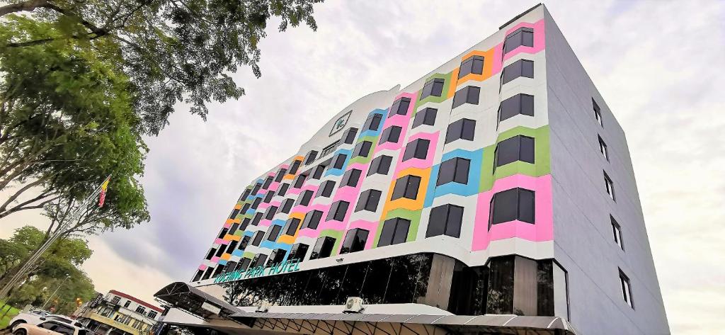 a building with a colorful facade at Kuching Park Hotel in Kuching