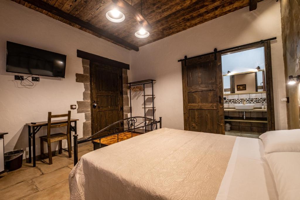 Postel nebo postele na pokoji v ubytování Il Rifugio dei Minatori