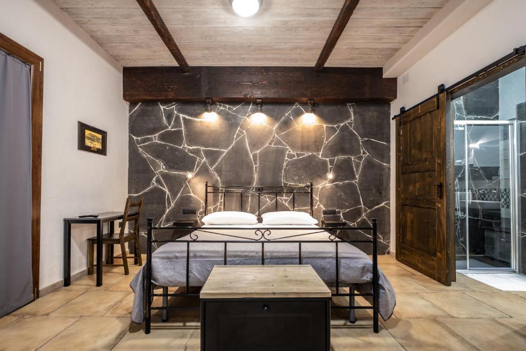 Postel nebo postele na pokoji v ubytování Il Rifugio dei Minatori