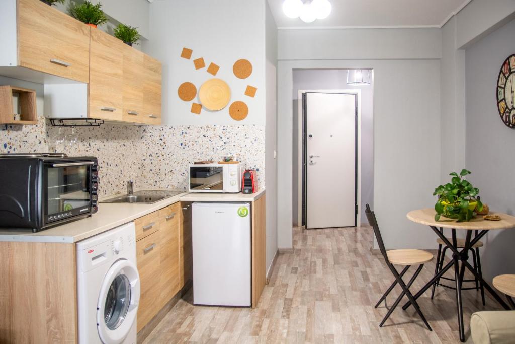Kuchyň nebo kuchyňský kout v ubytování Ermou 18 Mosaics boutique apartment