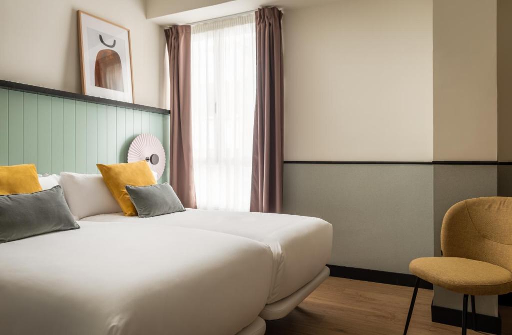 Postel nebo postele na pokoji v ubytování BYPILLOW Irala