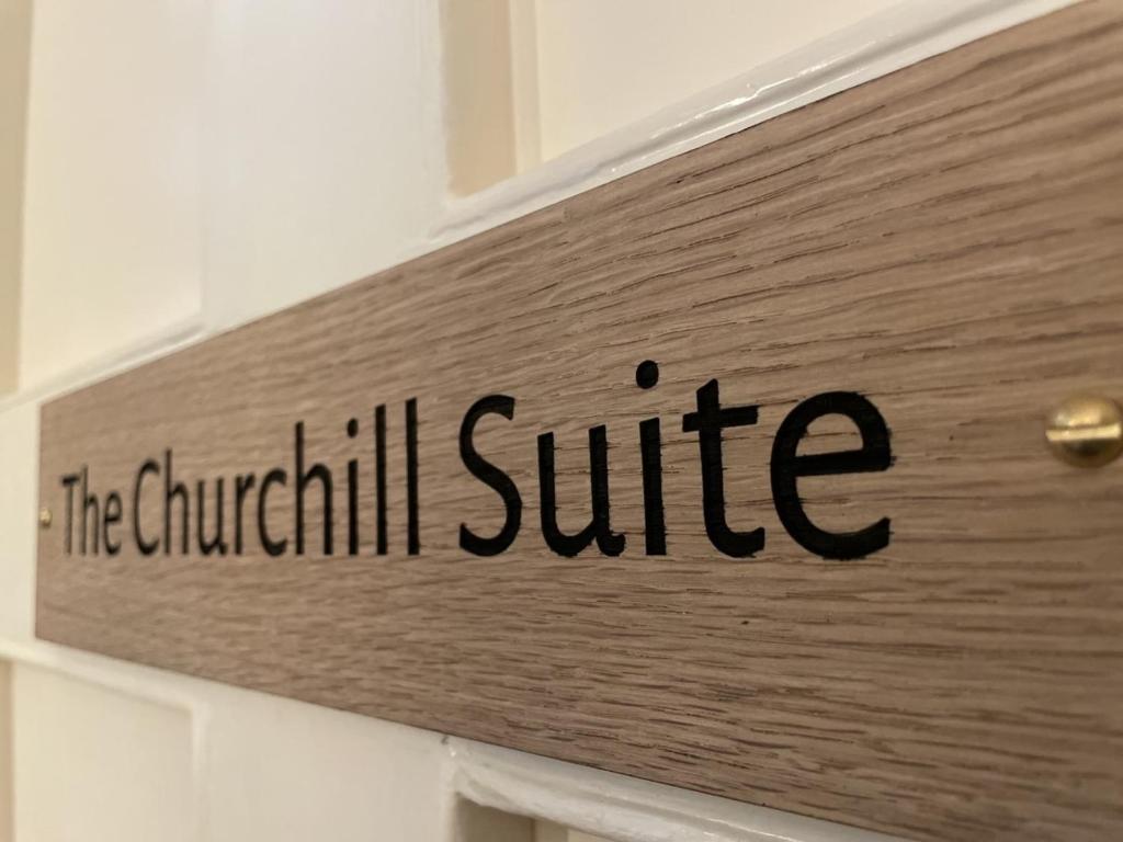 a sign that says the churchill sulfide on a door at The Randolph Hotel in Southwold