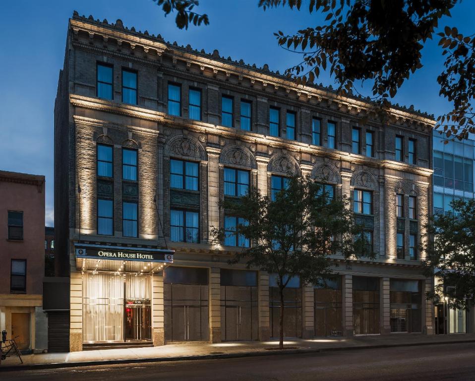 a building with lights on the side of it at Opera House Hotel in Bronx