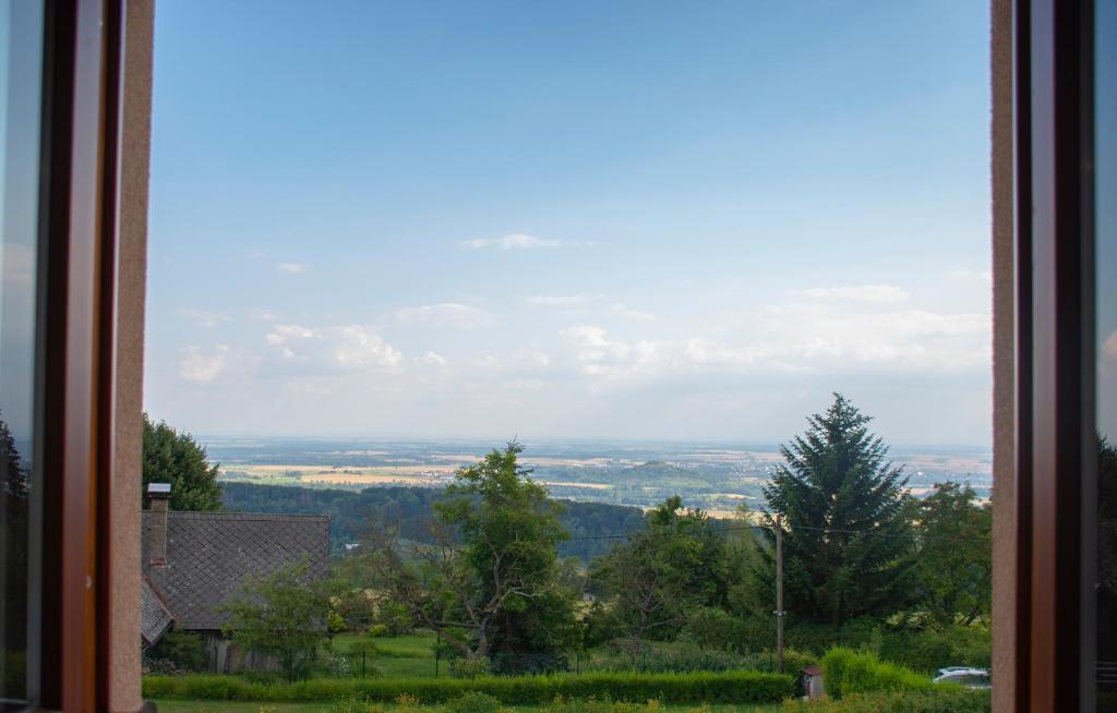 a view of the countryside from a window at Chata Na Vyhlídce in Železnice