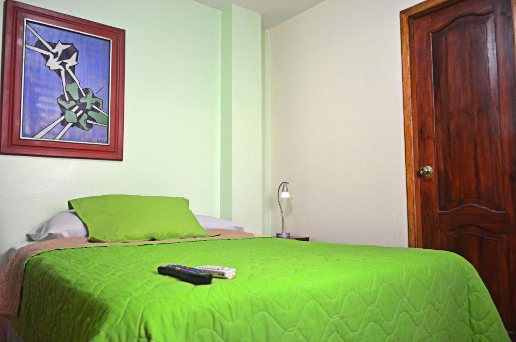 Postel nebo postele na pokoji v ubytování North Star Hostal Guayaquil