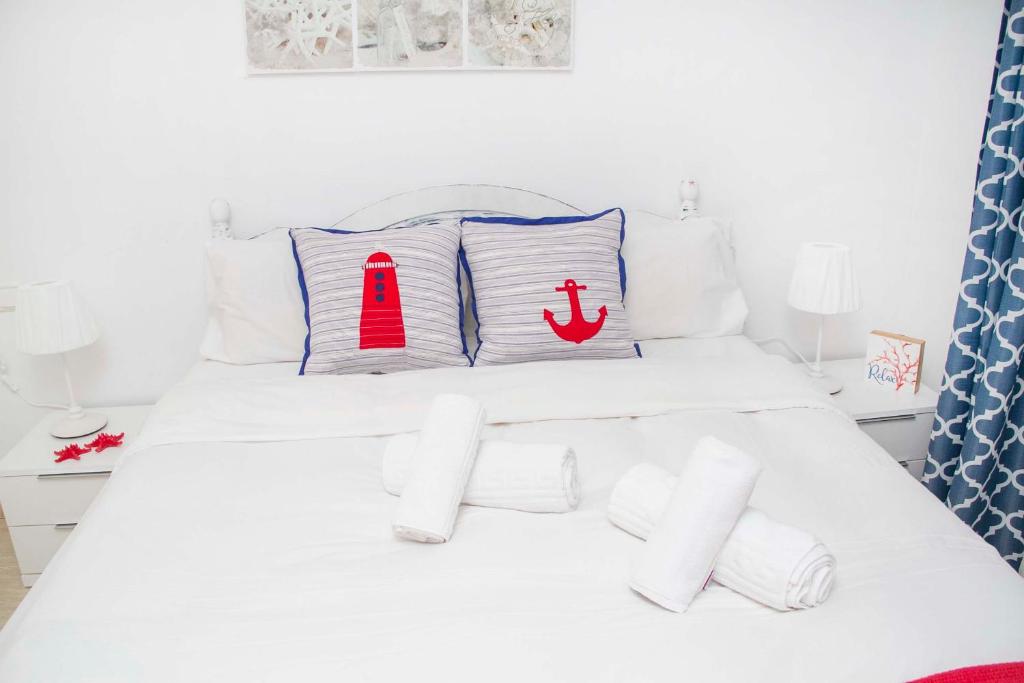 Posteľ alebo postele v izbe v ubytovaní Navy Apartment, El Poris