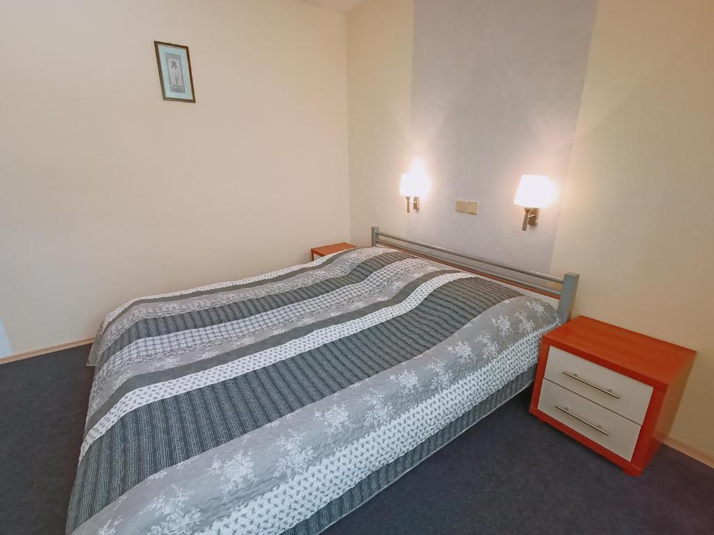 Postel nebo postele na pokoji v ubytování Kaštieľ Fričovce