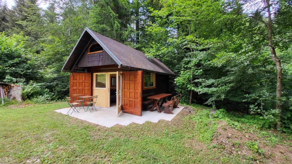 a small cabin in the middle of a forest at Glamping Fikfak in Bled