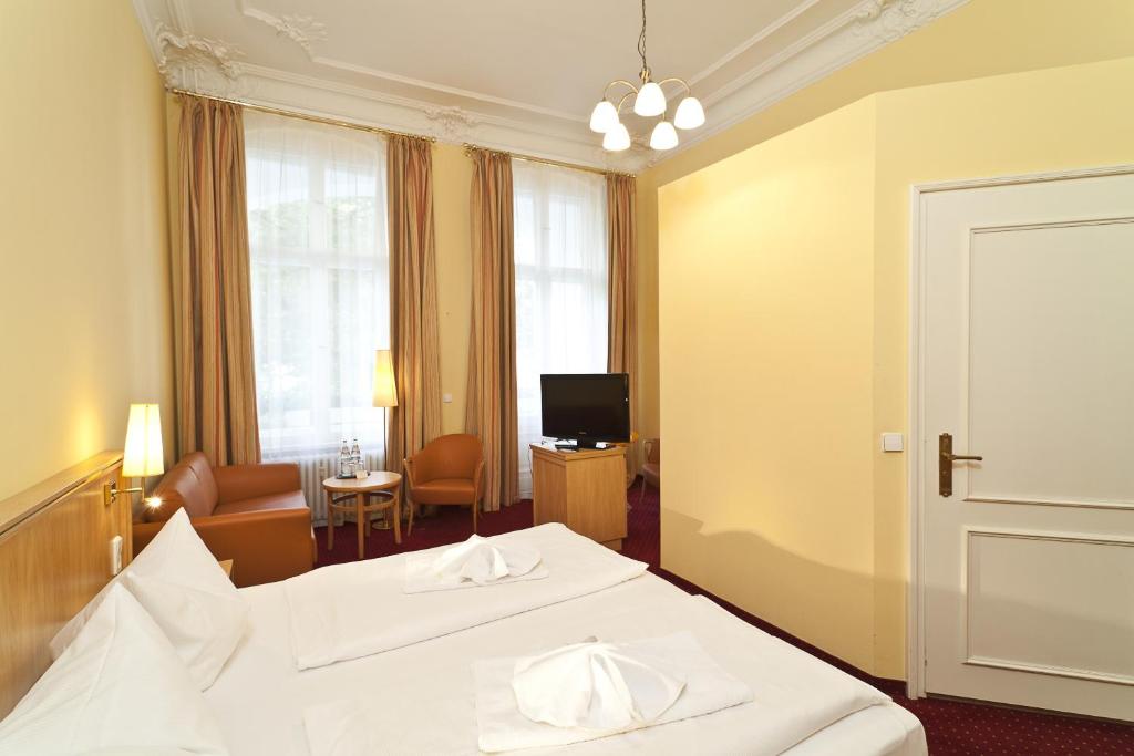 Postel nebo postele na pokoji v ubytování Hotel Vivaldi Berlin am Kurfürstendamm