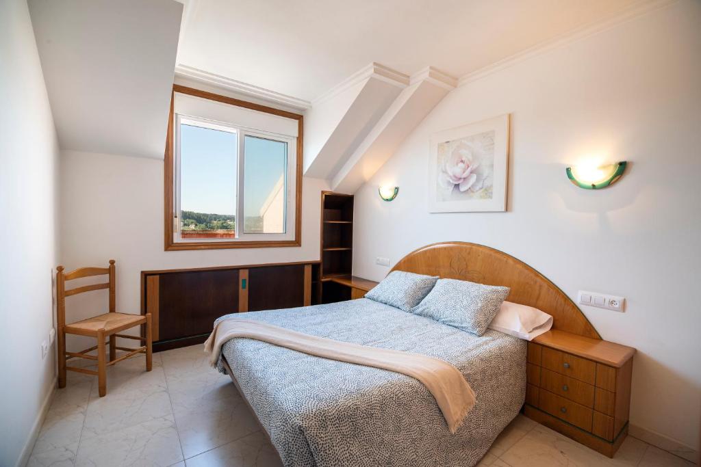 Posteľ alebo postele v izbe v ubytovaní Apartamento La Perla