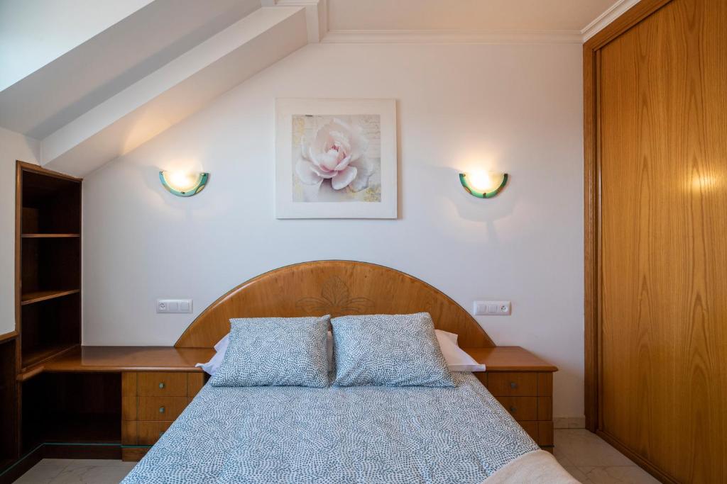 Posteľ alebo postele v izbe v ubytovaní Apartamento La Perla