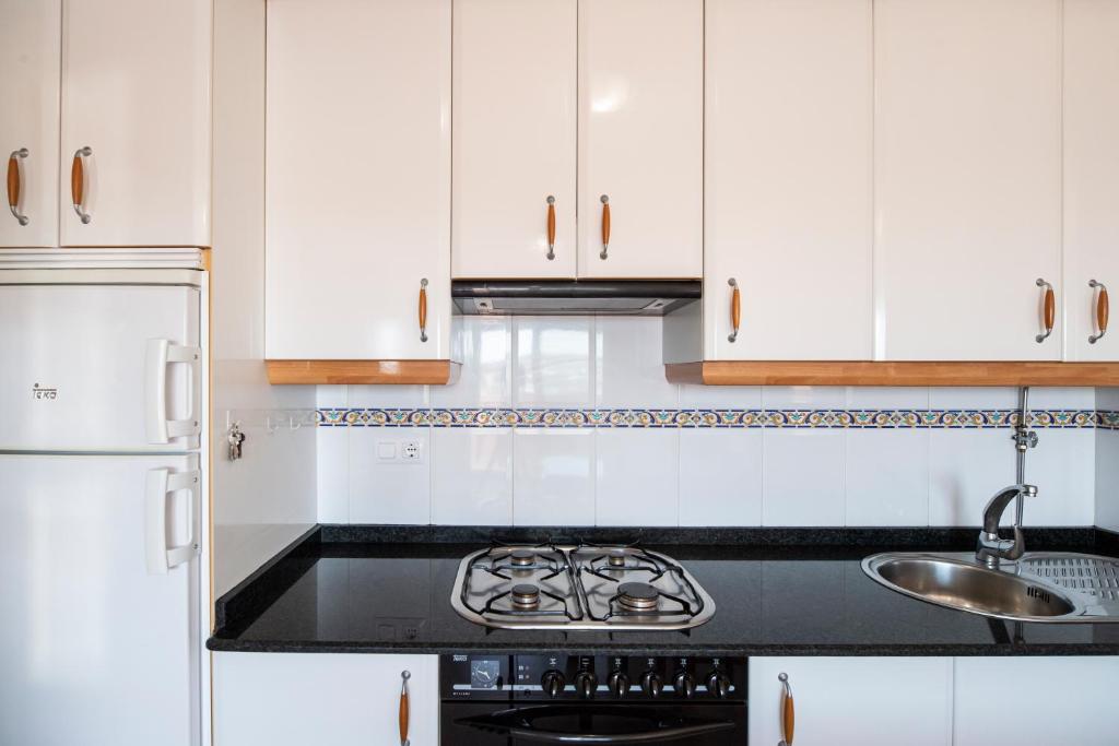 Kuchyňa alebo kuchynka v ubytovaní Apartamento La Perla