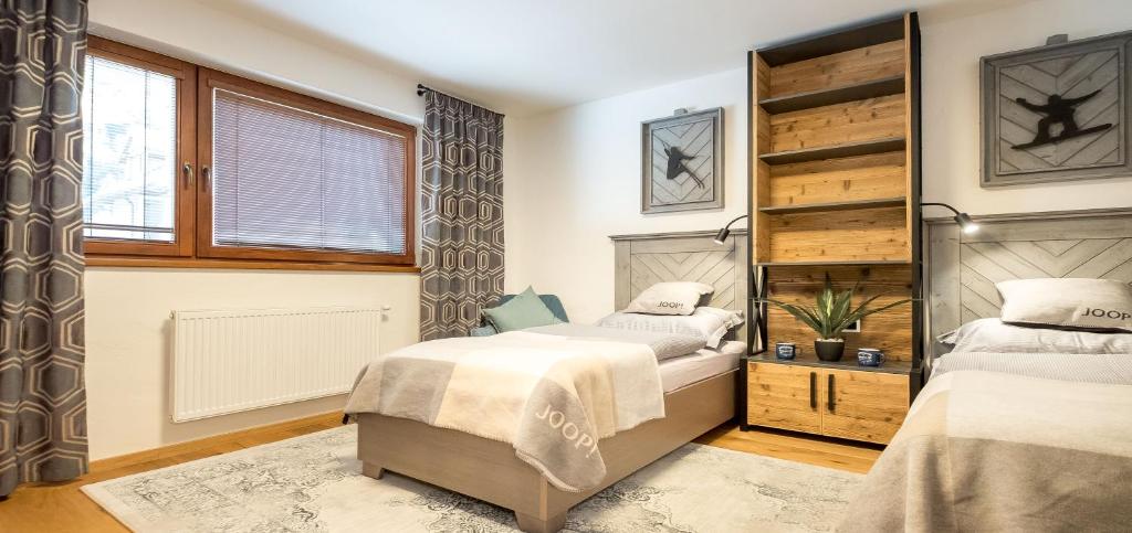 Postel nebo postele na pokoji v ubytování Apartman Stella