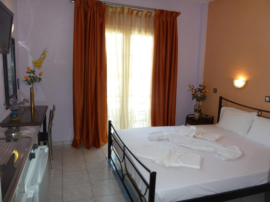 Postel nebo postele na pokoji v ubytování Evelin hotel