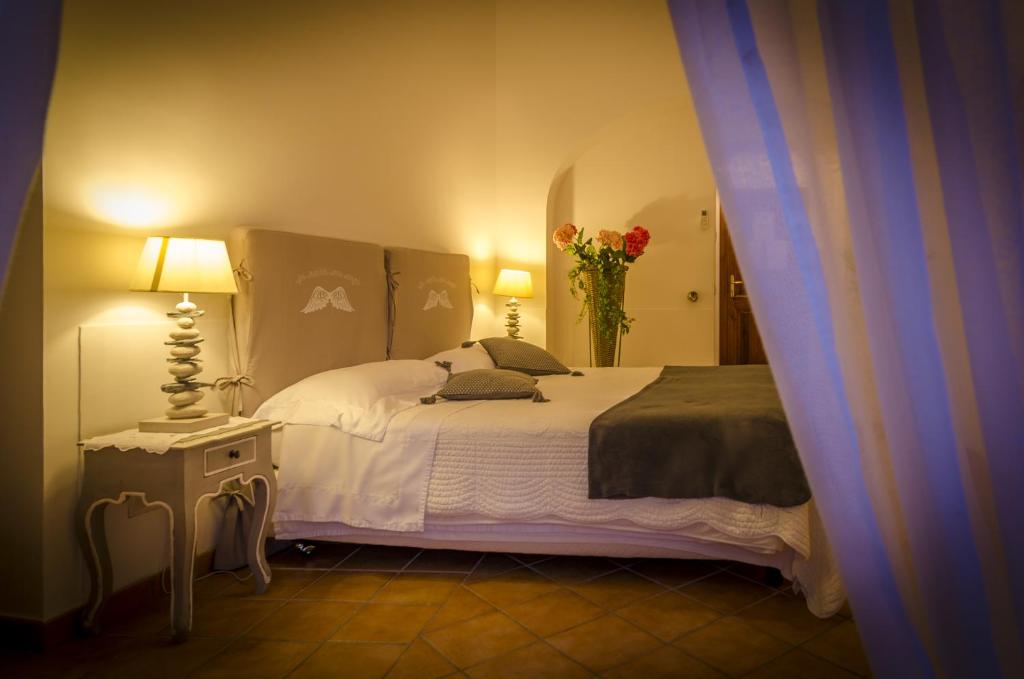 Postel nebo postele na pokoji v ubytování Maison Liparlati