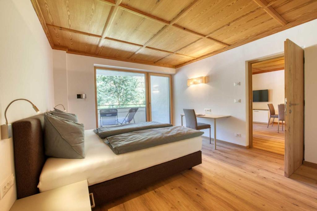 Postel nebo postele na pokoji v ubytování Residence Schnals