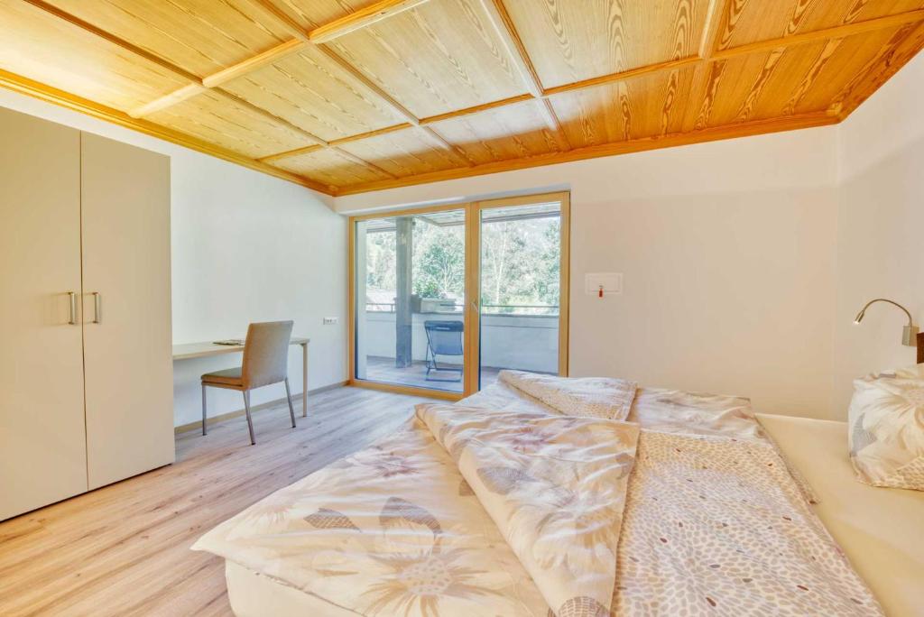 Postel nebo postele na pokoji v ubytování Residence Schnals