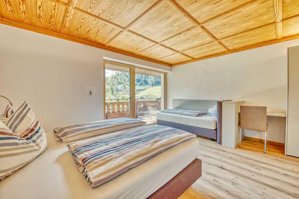 Postel nebo postele na pokoji v ubytování Residence Schnals