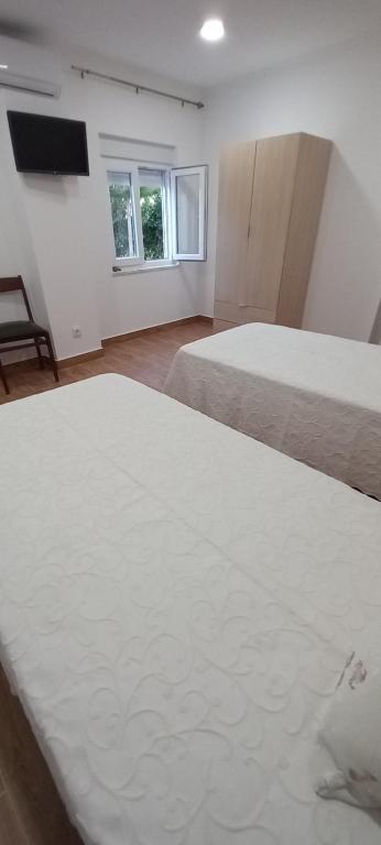 Postel nebo postele na pokoji v ubytování Monte da Vinha Nova