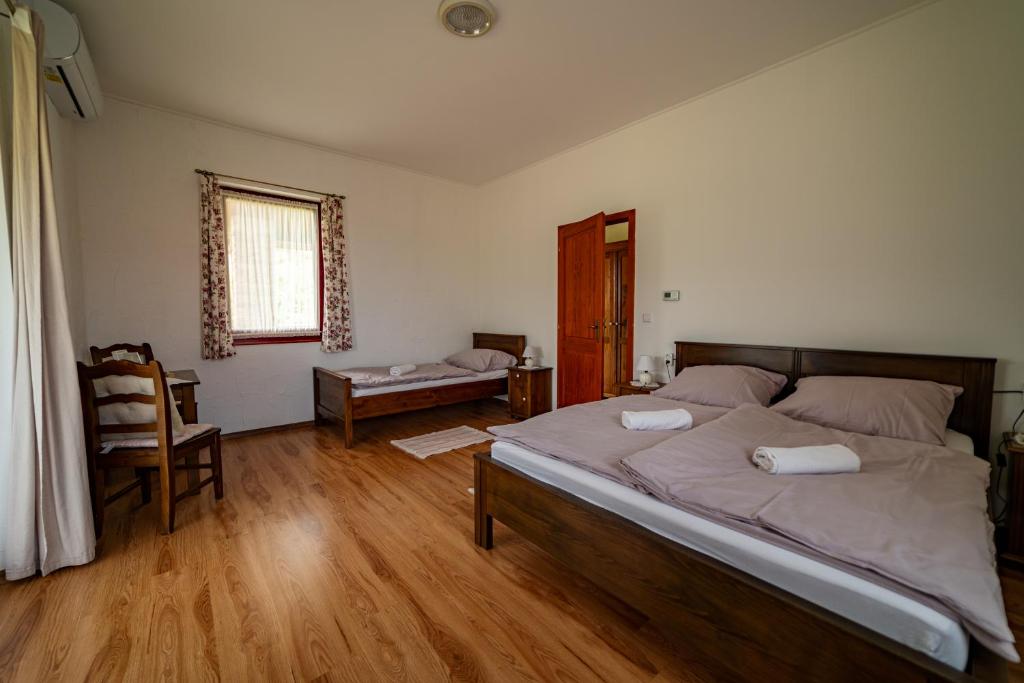 Postel nebo postele na pokoji v ubytování Szellő Porta