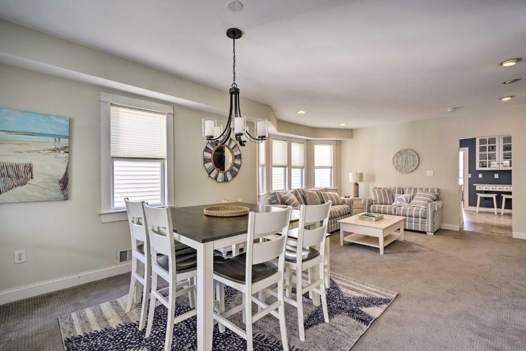 a dining room and living room with a table and chairs at Charming Ocean City Townhome Walk to Beach! in Ocean City