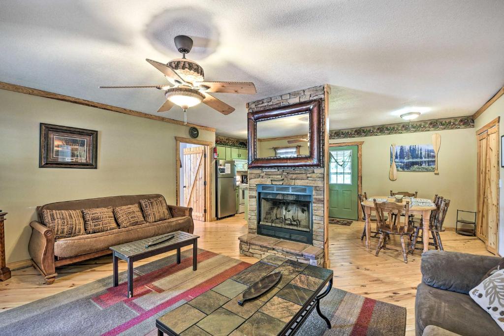 a living room with a couch and a fireplace at Cabin in Resort - half Mi to Guntersville Lake! in Guntersville