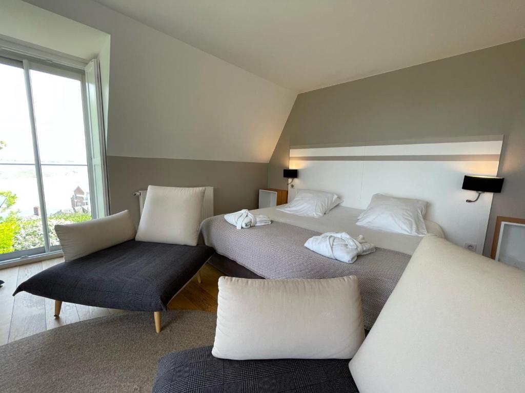 Postel nebo postele na pokoji v ubytování Hôtel - Spa Les Corderies