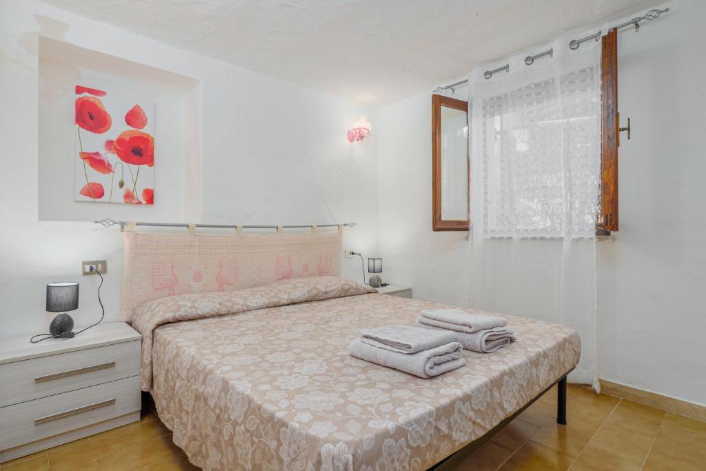 Posteľ alebo postele v izbe v ubytovaní Appartamento Anna