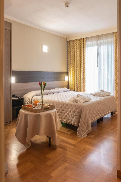 Кровать или кровати в номере Grande Albergo