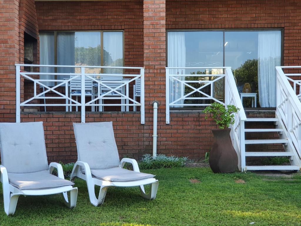 two chairs and a table on a brick house at The Gull in Sedgefield