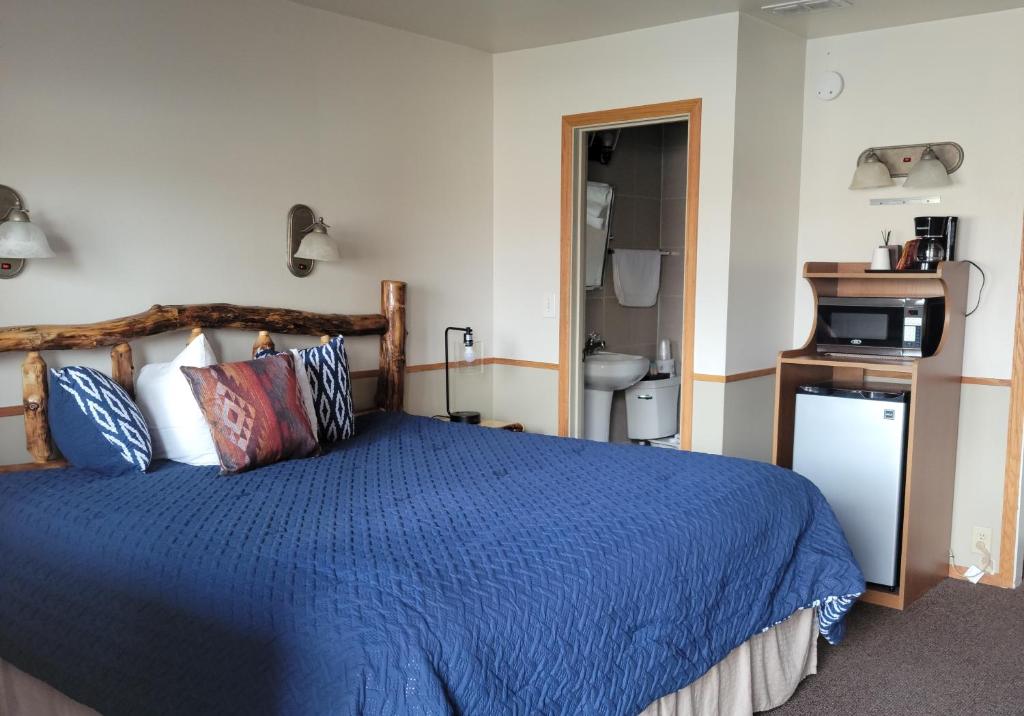 Postel nebo postele na pokoji v ubytování Sundance Motel