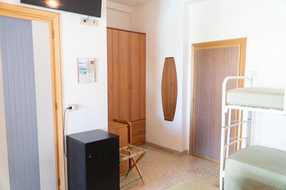 Postel nebo postele na pokoji v ubytování Hotel Cinzia