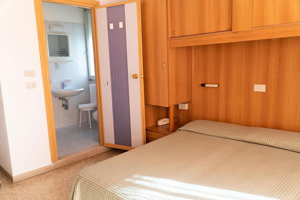 Postel nebo postele na pokoji v ubytování Hotel Cinzia