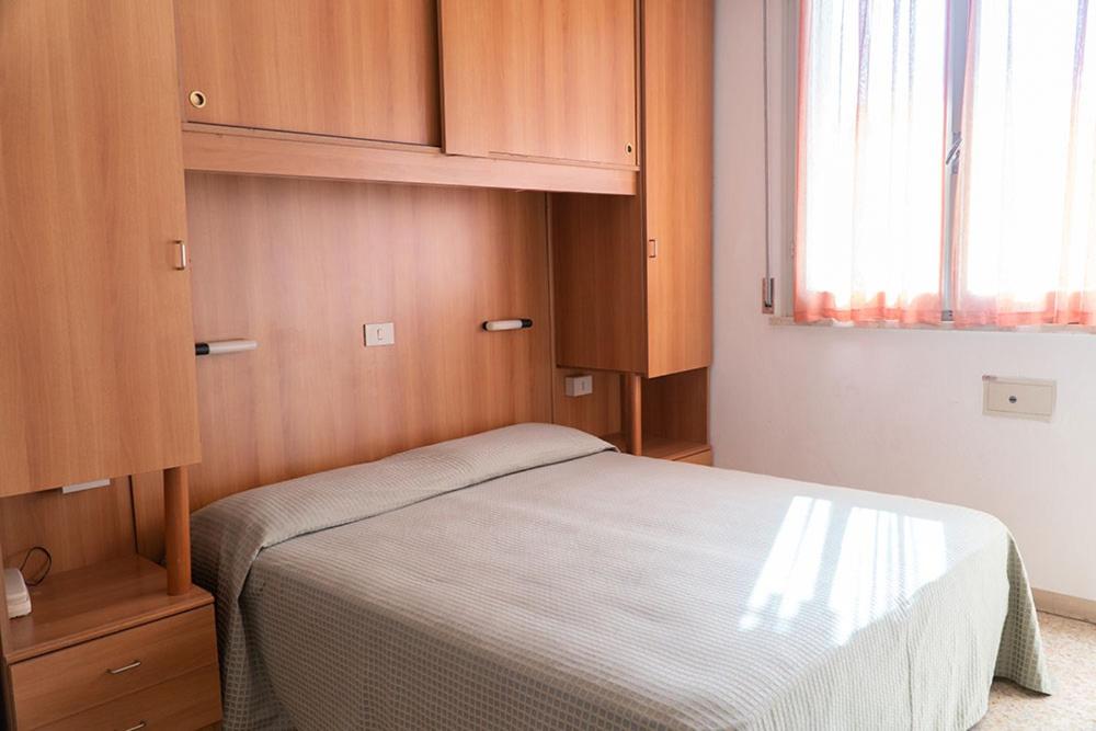 Postel nebo postele na pokoji v ubytování Hotel Cinzia