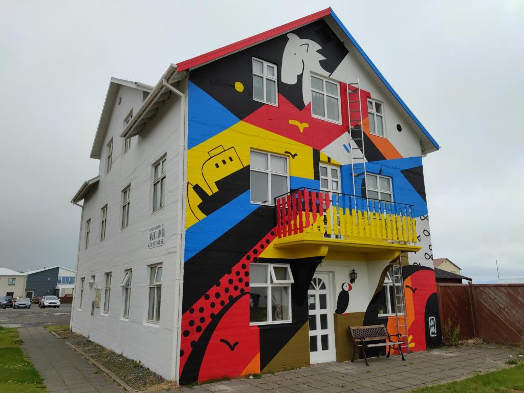 a building with a painting on the side of it at 550 Guesthouse in Sauðárkrókur