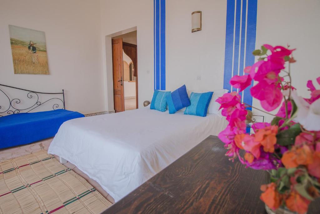 Postel nebo postele na pokoji v ubytování Auberge du Marabout