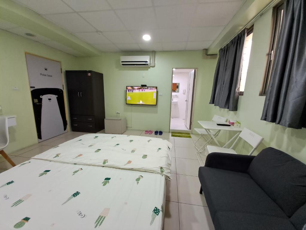 Postel nebo postele na pokoji v ubytování Ming House