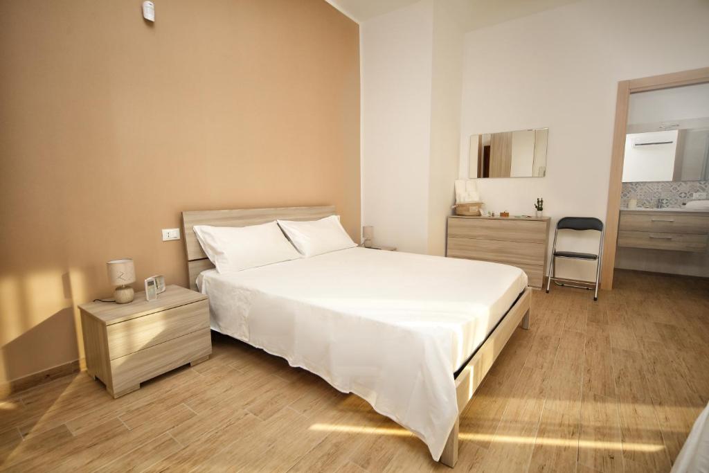 Posteľ alebo postele v izbe v ubytovaní B&B Bouganville