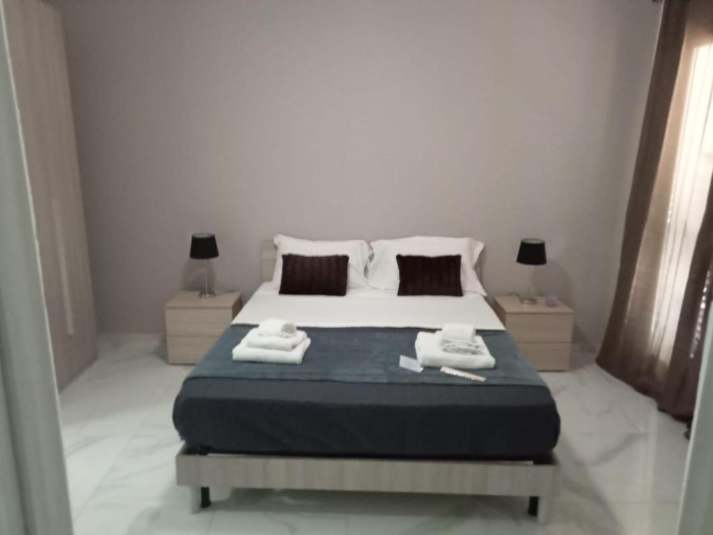 Ettore Casa Vacanze tesisinde bir odada yatak veya yataklar