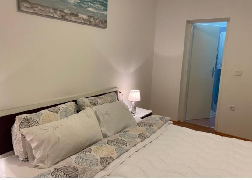 Posteľ alebo postele v izbe v ubytovaní Apartments Mišon