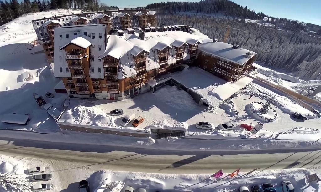 an aerial view of a resort in the snow at Aparthotel JAHORINA A123 in Jahorina