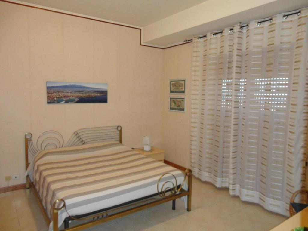 Postel nebo postele na pokoji v ubytování Casa delle Pomelie - Taormina & Etna Panoramic Views