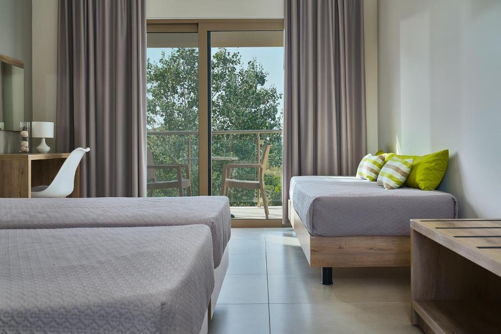 Postel nebo postele na pokoji v ubytování Grapevines Hotel