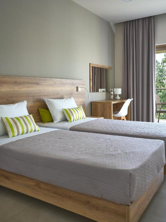 Postel nebo postele na pokoji v ubytování Grapevines Hotel